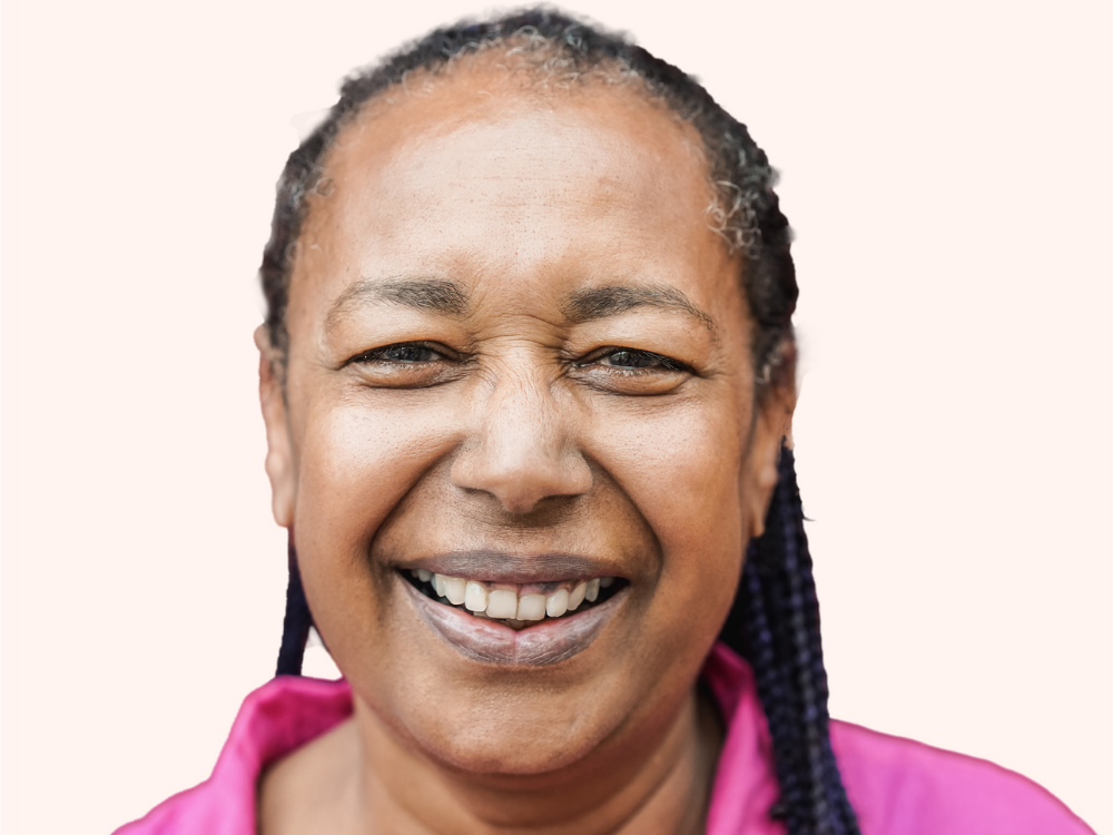 Woman smiling with pink shirt on